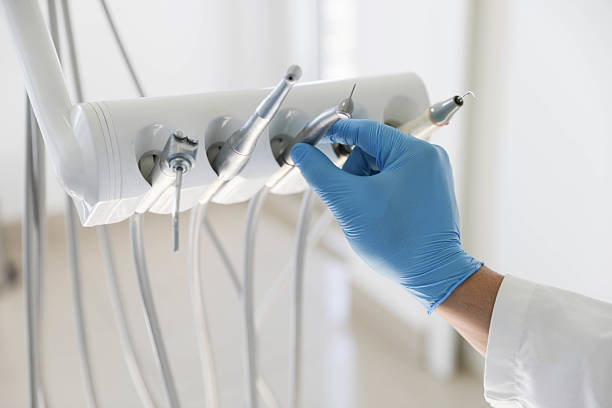 Professional Tooth Extraction technician working in Urbana, IA